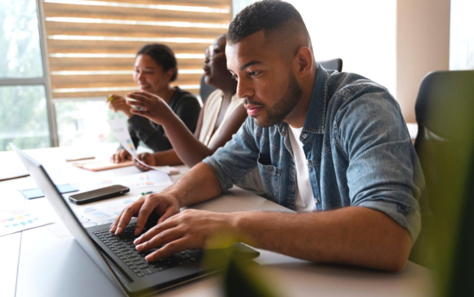 Financial professionals collaborating on data analysis in modern workspace